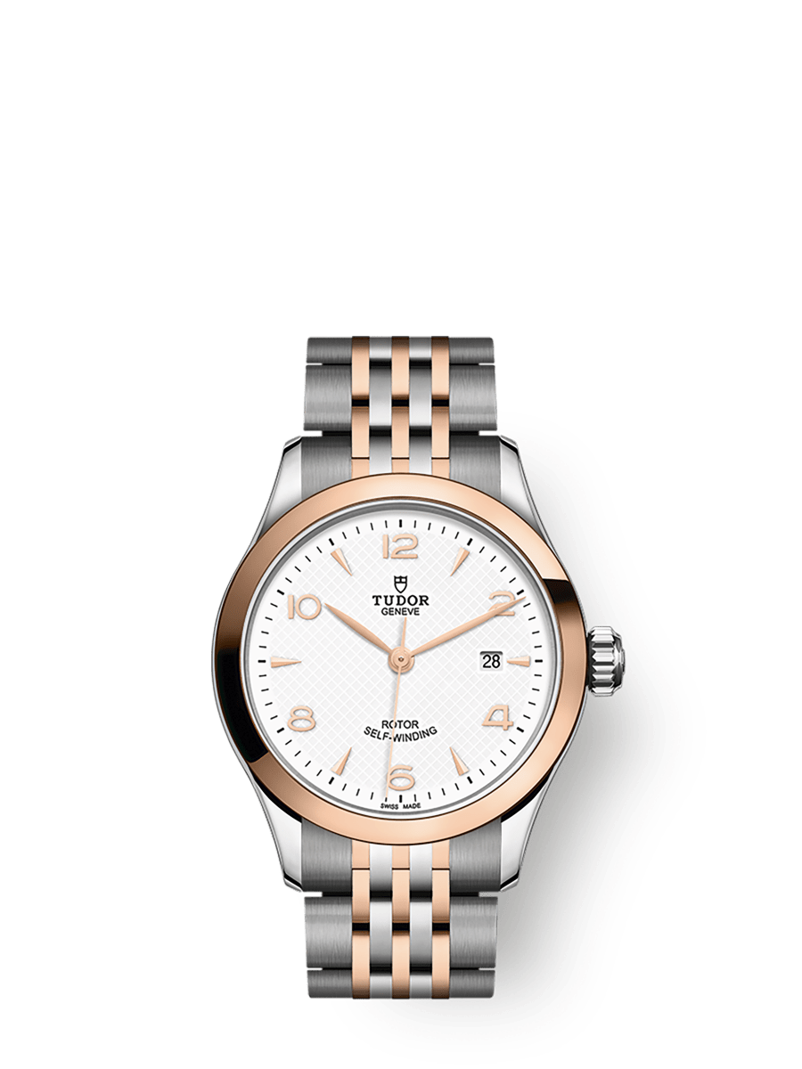 TUDOR 1926 28mm Automatic White Dial First center links in steel or solid rose-gold. Remaining center links in steel or steel covered by a 0.2mm rose gold cap Watch